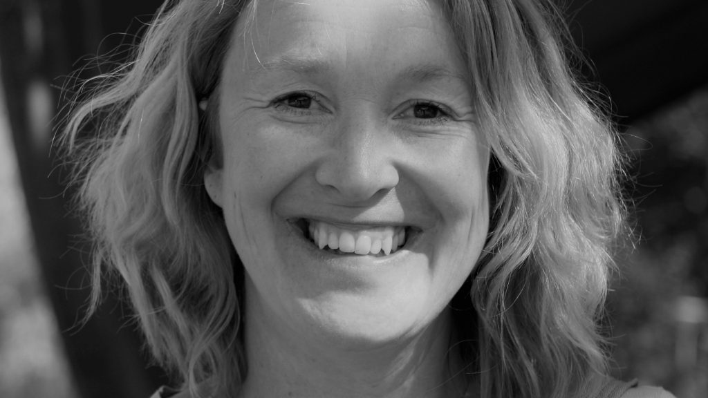 black and white photo of smiling woman