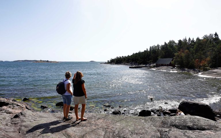 Two persons overlooking the sea